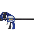 Heavy Duty One Hand Bar Clamp For Woodworking And Shop Fixes With Quick Toggle Spreader Mode And Grippy Pads That Lock Down Tight Without Bending Or Scuffing On Demanding Builds Right Now, side view of blue clamp with ergonomic grip.