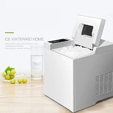 Premium Stainless Steel Freestanding Ice Maker Cranks Out Thirty Three Pounds Bullet Ice Daily With Slick Touch Panel No Sweat Rapid Chilling For Kitchens Bars And Office Spots on countertop with ice.
