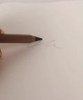 Ever Pencil Cap Set With A Sleek Metal Infinity Pencil writing smoothly on paper, showcasing ease of use and no sharpening needed.
