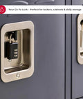 Master Lock black 3-digit combination locker padlock mounted on an indoor gym locker, front view