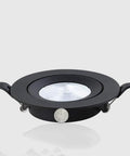 WKNHHL Recessed Lighting Housing Trim Kits Ultra Slim Led Embedded Downlight Black Aluminum Panel, round spotlight with coin for scale.