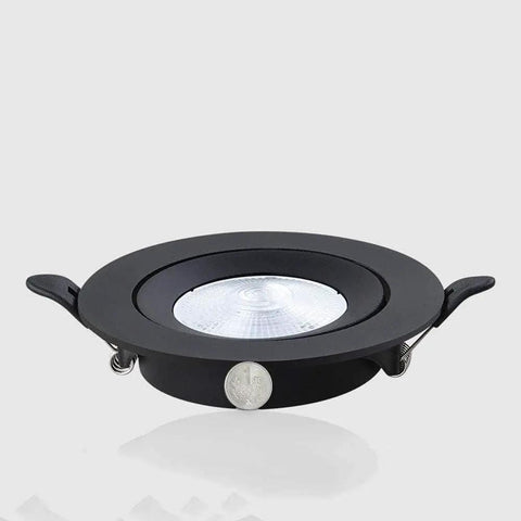 WKNHHL Recessed Lighting Housing Trim Kits Ultra Slim Led Embedded Downlight Black Aluminum Panel, round spotlight with coin for scale.
