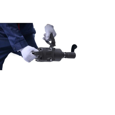 Rugged Pro-Level 1 Inch Pneumatic Impact Wrench serving hefty 2730 Ft Lbs reverse torque held by gloved hand for truck repairs.
