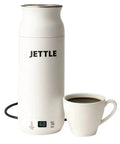 Travel Stainless Steel Electric Kettle 450ml With Temperature Control LED Auto Shutoff next to a cup of coffee