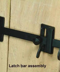 Heavy Duty Rectangular Gate Thumb Latch With Dead Simple Two Way Throw Rock Solid Steel Construction And Smooth Black Powder Coat Exterior Built Like A Tank For Real World Use on wooden door.