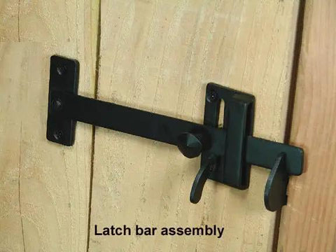 Heavy Duty Rectangular Gate Thumb Latch With Dead Simple Two Way Throw Rock Solid Steel Construction And Smooth Black Powder Coat Exterior Built Like A Tank For Real World Use on wooden door.