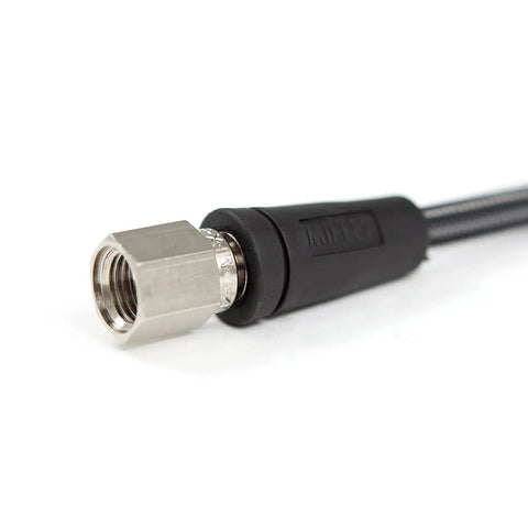 Close-up of Graphite Carbon Miflex High Pressure Scuba Hose 6 Inch, 7/16 Inch 20 Female With Strain Relief and braided nylon exterior.