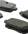 Centric C-Tek ceramic rear brake pad set for Nissan, four pads with grey friction material.