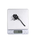 2207 Brushless Motor 1800Kv 2450Kv 2750Kv for 2 to 6S Drones on digital scale showing 32.8 grams