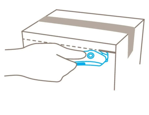 Illustration of using Concealed Blade Safety Cutter for box tape and shrink wrap, black ergonomic handle, securing cut on cardboard.