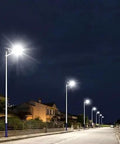 Heavy Duty Solar Street Light With Dang Bright 6000 Lumens And Heckin Wide 320 Degree Coverage Featuring Wireless Remote Plus Dusk To Dawn Auto Mode For Rock Solid Yard And Parking Lot Illumination illuminating a quiet street at night.