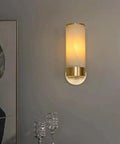 Single Natural Alabaster Rock Wall Sconce With Polished Brass Trim Features E14 Socket and Game Changer Soft Glow to Bring Killer Vibes to Bathrooms Bedrooms Halls As Sleek Wall Fixture.