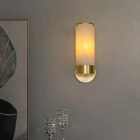 Single Natural Alabaster Rock Wall Sconce With Polished Brass Trim Features E14 Socket and Game Changer Soft Glow to Bring Killer Vibes to Bathrooms Bedrooms Halls As Sleek Wall Fixture.