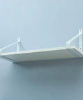 Heavy Duty Wall Shelf Brackets 2 Pack White Industrial Floating Metal Brackets with shelf attached to wall.