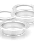 Four silver grommets from 1.5 Inch Grommet Tool Kit for Curtains and Drapes for DIYers with Setter, Hole Punch Cutter, Block Anvil and 10 Heavy Duty Grommets Ideal for Tents Tarps Textiles and More.