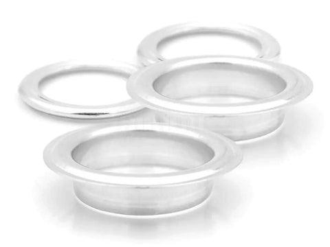 Four silver grommets from 1.5 Inch Grommet Tool Kit for Curtains and Drapes for DIYers with Setter, Hole Punch Cutter, Block Anvil and 10 Heavy Duty Grommets Ideal for Tents Tarps Textiles and More.