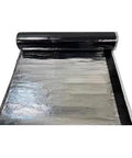 Straight Up Heavy Duty Self Adhesive Waterproof Bitumen Sealant Tape For Roof And Pipe Leak Fix With Top Shelf UV Shield Aluminum Foil Underlayment Roll partially unrolled, showcasing its shiny surface.