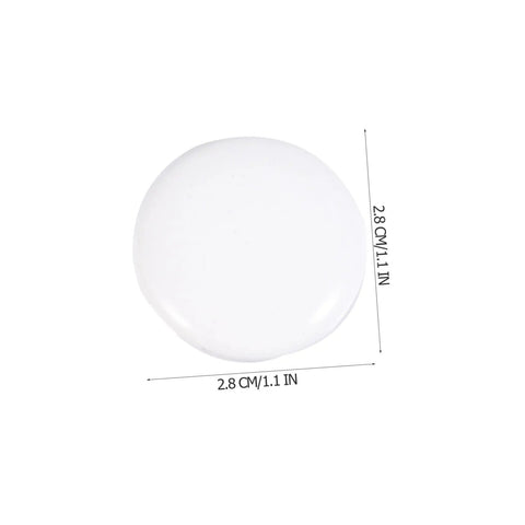 Close-up of a round knob from Six Piece White Alloy Round Cabinet Handles Set For Kitchen Cabinets And Furniture Drawer Knobs Single Hole Smooth Metal Pulls For Wardrobes Closets And Desks