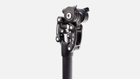 SP12 NCX Suspension Seatpost for MTB road and gravel bikes showing parallelogram design with consistent pedal positioning.