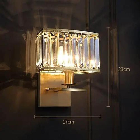 Sleek Crystal Brass Wall Sconce, 23cm height, 17cm width, modern design for bedroom or hallway, uses standard E14 bulbs.