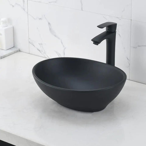 Black oval vessel sink with faucet and drain combo above counter bathroom sink porcelain vessel basin modern European design