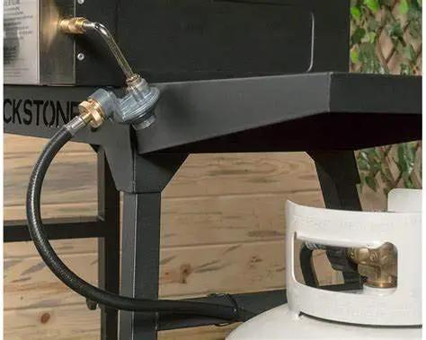 Propane Hose 1lb To 20lb Adapter For 12 Foot Connection attached to Blackstone griddle and LP tank, safe flow protection visible