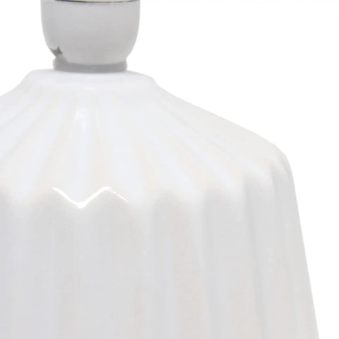Close-up of the off-white ceramic base of the Petite Pleated Ceramic Table Lamp With Off White Fabric Shade 5 Ft Cord 40W Equivalent Type B Bulb Not Included Classic English Style Accent Light For Bedroom Or Living Room Cozy Glow.