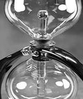 Close-up of DGENIUS All Glass Siphon Coffee Maker With Glass Filter Rod No Paper Or Cloth Brewing Industrial Design Classic 1.1L
