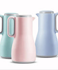 Grab And Go Kickass Vacuum Insulated Travel Thermos With Secure Silicone Lid Locks In Scalding Heat Or Ice Cold Temperatures All Day Long Killer For Daily Commutes, featuring three stylish pastel-colored bottles.