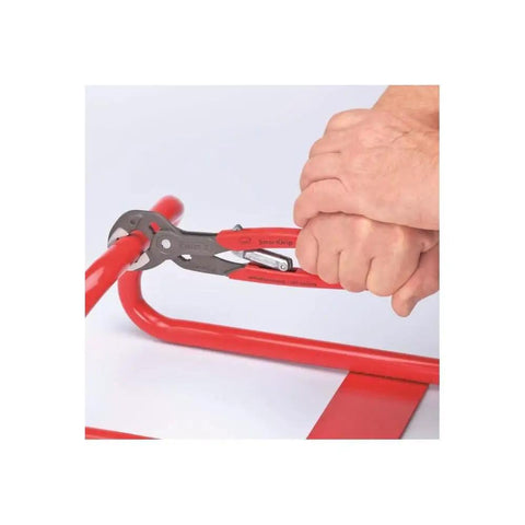 Person using Auto Adjusting Water Pump Pliers with Self Adjusting Jaw for Quick One Handed Use on a red pipe, 250 mm pliers