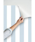 Easy Peasy Peel And Stick Wallpaper Removable Classic Traditional Linen Texture Wallcovering For Renters And Accent Walls, blue and white striped pattern being applied.