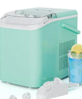 Portable Ice Maker with Self Cleaning System and Scoop Delivers Fresh Ice in Under 6 Minutes for Any Countertop Vibes Comes Complete with Storage Basket for Effortless Serving while Bullet Shaped Cubes Ensure Your Beverages Stay Frosty During Weekend next to a glass of blue drink.