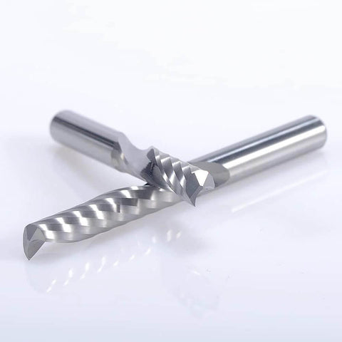 Router bits, two 1/8 in shank, single-flute up-cut end mills with spiral flutes, angled view