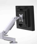 Dual Arm Gas Spring Monitor Mount With Rock Solid Desk Clamp And Nifty Workspace Organizer Tray For 15 To 32 Inch Screens from the side, showing adjustable arm.