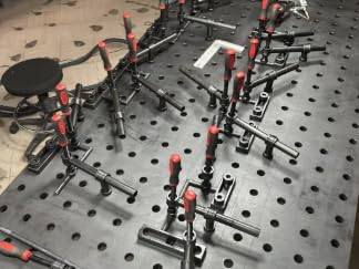 180 Degree Welding Fixture Screw Clamps For Five Eighth Inch Tables Two Pack Tough As Nails Heavy Duty Solid Steel in use on welding table
