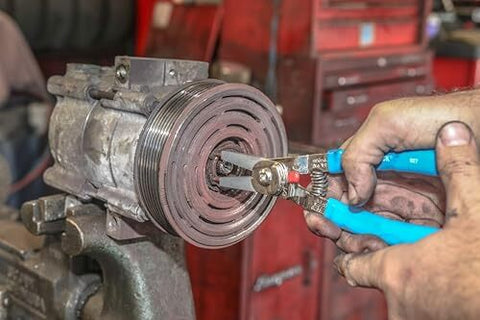 Snap Ring Pliers 927 Pro Grade For Internal And External Circlips Five Tip Set in use on machinery.