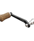 Premium Single Rocker Fishing Reel Handle With Rubber Cork Knob Carbon Fiber Core 70Mm Screw In Arm Length showing black and cork details.
