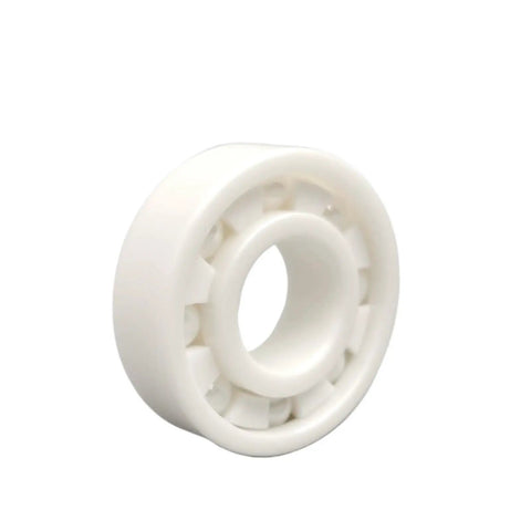 Premium Rock Solid Zirconia Ceramic Bearings Five Piece Set High Temperature Resistant Self Lubricating Dry Run Design Non Magnetic Insulated For Industrial Motors with a single white zirconia ceramic bearing.