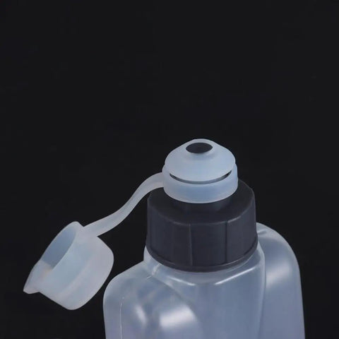 Close-up of the cap on a Curved 400ml Water Bottle For Running And Cycling, Squeeze Cup Ergonomic Sports Flask.