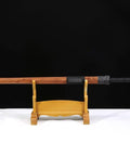 Hand-Forged Damascus Han Sword With 42-Inch Battle-Ready Chinese Longquan Blade on wooden stand, rosewood handle and scabbard.