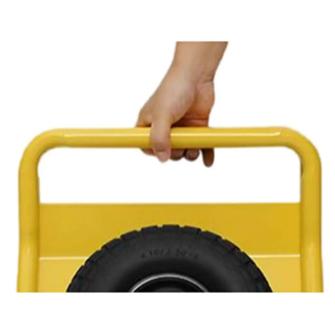 Hand grasping the handle of Built Like A Tank Heavy Duty Drywall Door Dolly With Snappy Auto Clamp And Smooth Rolling Ten Inch Solid Rubber Wheels Premium Steel Sheet Carrier.