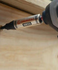 Apex Vortex Bit Holder One Quarter Inch Hex Shank Three And A Half Inch Length in use with an impact driver on wood surface