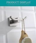 Slick Brushed Stainless Steel Double Robe Hooks With No Hassle Wall Mount For Bathroom And Shower Beefy Coat And Hat Hangers Modern Compact Design Quick Install Four Pack Hardware Set displaying a hooked brush.