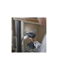 Person mounting Sys3 Systainer Rails Rack System For DIY Organization onto a wooden surface with power drill.