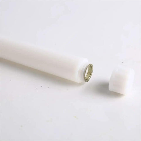 Base of Set Of 12 Remote Flameless LED Taper Candles With Yellow Flicker Light Realistic White Plastic Candlesticks 11 Inch Tall Battery Operated
