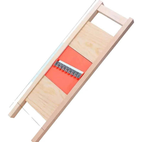 Angled front view of manual potato crinkle cutter with wooden frame, orange base, and stainless steel blade