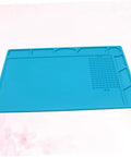 Top Notch Silicone Repair Mat With Heat Resistant Non Slip Surface And Precision Pin Layout For Soldering Stations Laminating Machines And No Sweat Tech Fixes in blue.