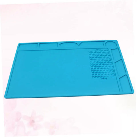 Top Notch Silicone Repair Mat With Heat Resistant Non Slip Surface And Precision Pin Layout For Soldering Stations Laminating Machines And No Sweat Tech Fixes in blue.