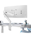 Built Different White Monitor Articulating Arm Mount With Rock Solid Height Adjustment Ultra Smooth Universal Desk Glide And Clean Cable Routing For Every Screen Setup, shown mounted to a desk.