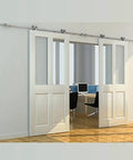 Apex Stainless Steel Sliding Barn Door Hardware Kit 8 Foot Track Double Door Kit with Top Mount Rollers installed in modern room